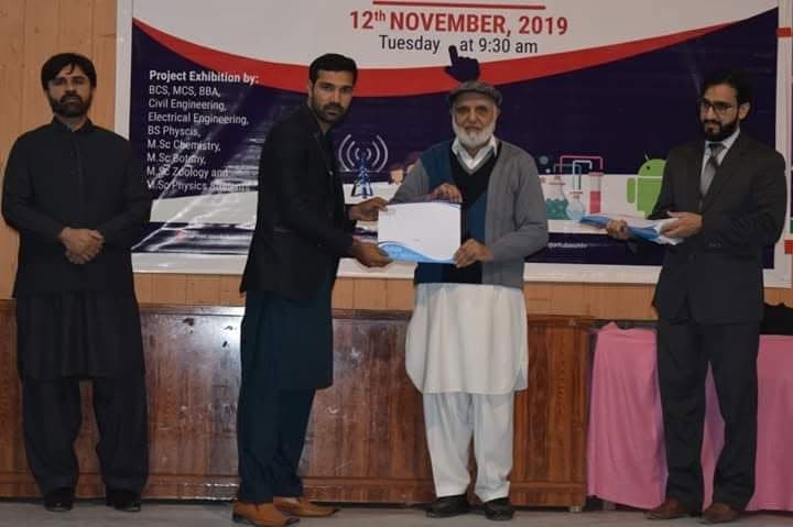 Certificate presentation at a project exhibition, 12 November 2019